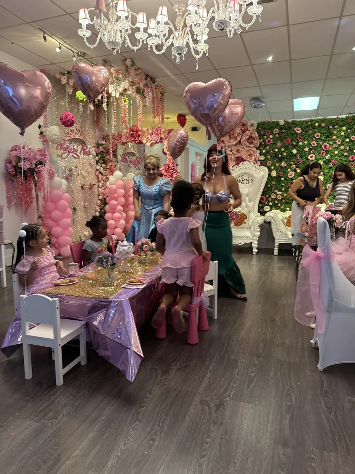 Ariel and Cinderella at a princess tea party table in Fort Lauderdale
