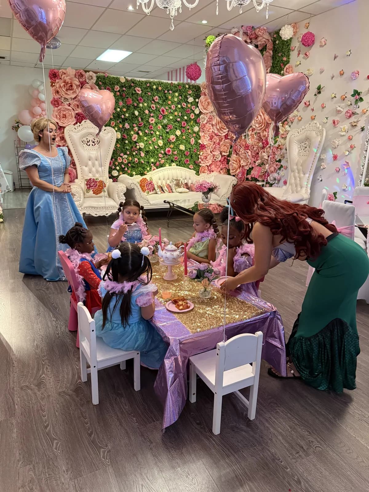 Ariel and Cinderella hosting a princess tea party with girls in Fort Lauderdale