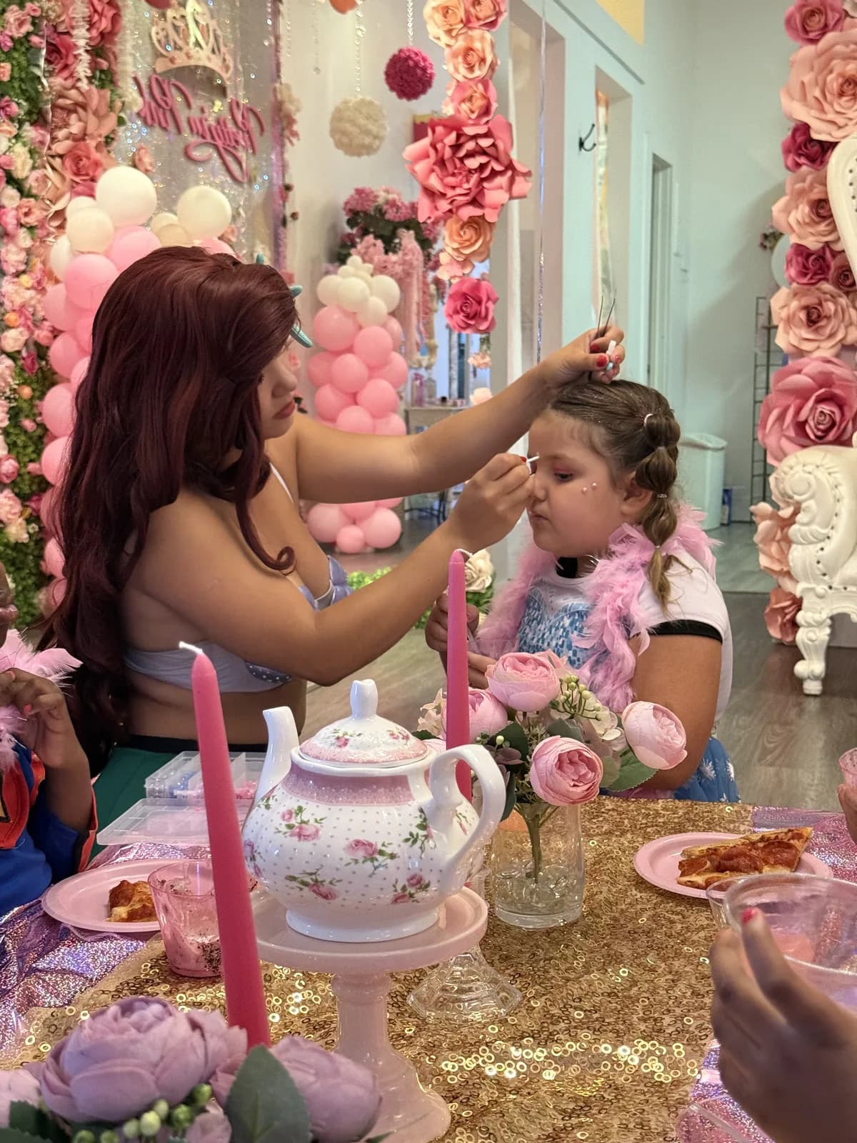 Ariel mermaid princess doing makeup at girls spa birthday party South Florida