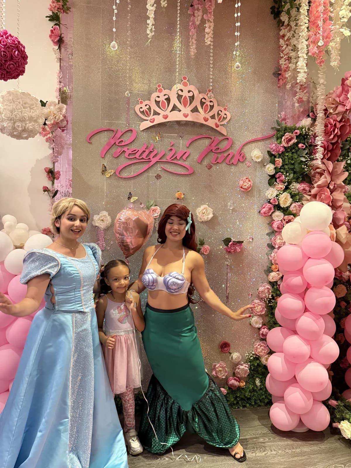 Birthday girl with Cinderella and Ariel at a princess spa party in Fort Lauderdale