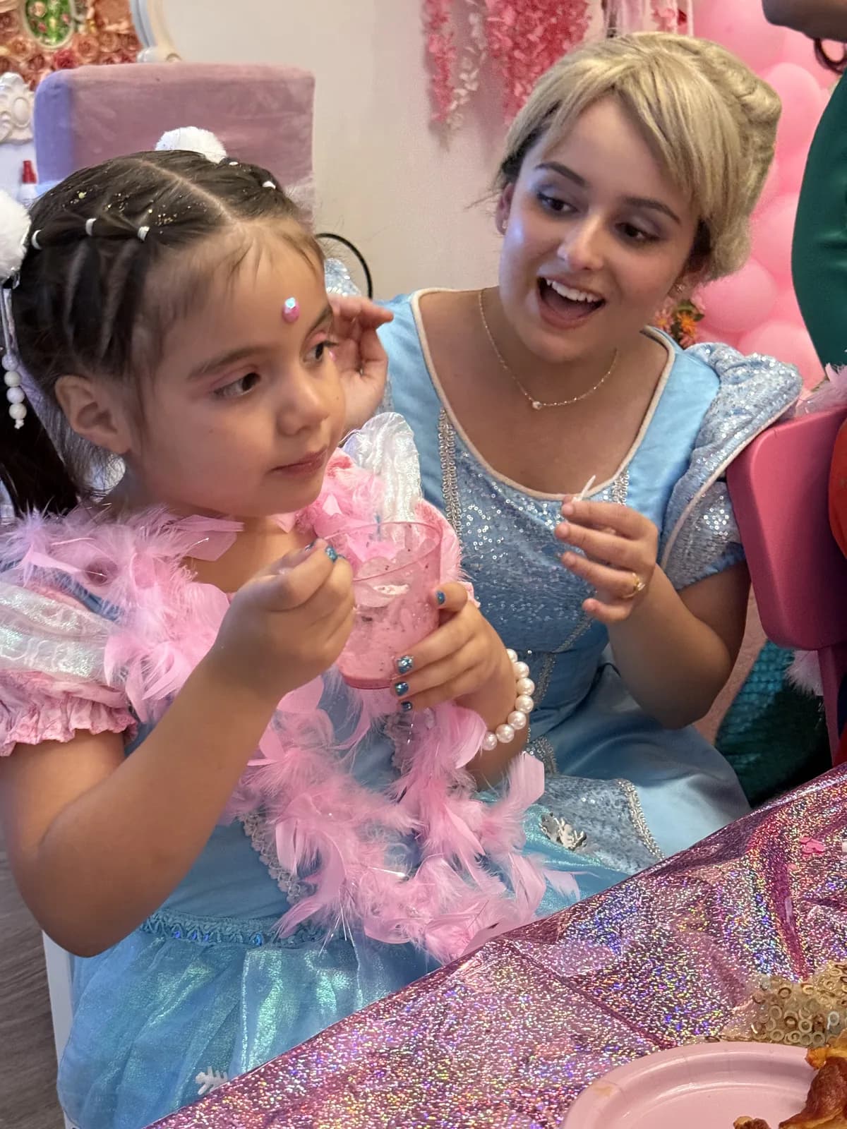 Cinderella leading a craft activity at a princess birthday party in Fort Lauderdale