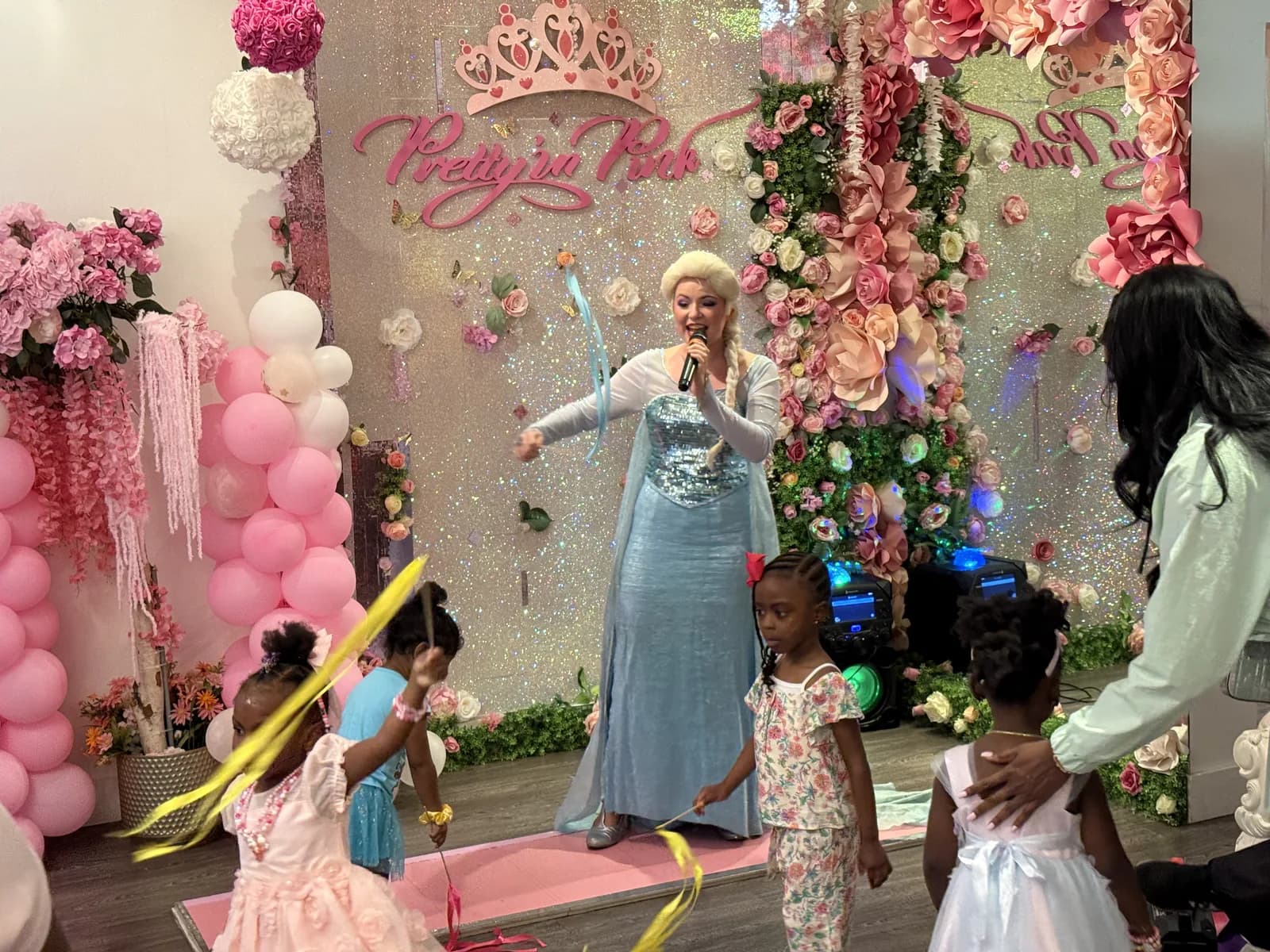 Elsa princess character dancing with girls during a private playdate in Fort Lauderdale